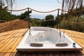 Hot tub in the hotel room suite balcony with sea view. Summer day honeymoon romantic luxury resort vacation place Royalty Free Stock Photo