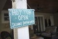 Hot Tub Open! a wooden sign at a vacation house in Royalty Free Stock Photo