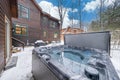 Hot tub in the yard of a suburban house in winter. Royalty Free Stock Photo