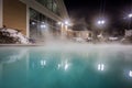 Hot tubs and ingound heated pool at a mountain village in winter Royalty Free Stock Photo