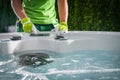 Hot Tubs Technician Performing Seasonal Garden SPA Maintenance Royalty Free Stock Photo