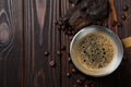 Hot turkish coffee pot, beans and chocolate on wooden table, flat lay. Space for text Royalty Free Stock Photo