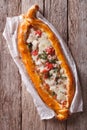 Hot Turkish pide pizza closeup on a table. vertical top view Royalty Free Stock Photo