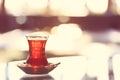 Hot turkish tea outdoors near glass wall. Turkish tea and traditional turkish culture concept Royalty Free Stock Photo