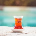 Hot turkish tea outdoors near water. Turkish tea and traditional Royalty Free Stock Photo