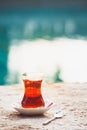 Hot turkish tea outdoors near water. Turkish tea and traditional Royalty Free Stock Photo