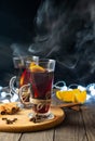 Hot warming mulled wine with citrus, cinnamon and anise spice