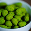 Hot Wasabi Peanuts. Wasabi coated peanuts close-up. Green spicy Japanese snack