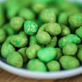 Hot Wasabi Peanuts. Wasabi coated peanuts close-up. Green spicy Japanese snack