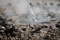 Hot water erupting from a geyser frozen in time. Geysers Del Tatio, Antofagasta, Chile.