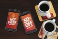 Hot Week 50% Off discounts. Advertising, Special Offer. Two cell phones and two coffee cup over the table. Marketing, Internet bus