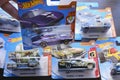 A Hot Wheels purple American custom die cast toy car from Muscle Mania series on hand