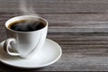 Hot white coffee cup on grunge vintage wooden tabletop Royalty Free Stock Photo