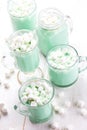 Hot white mint chocolate with marshmallows, white background. Holidey drink