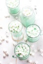 Hot white mint chocolate with marshmallows, white background. Holidey drink