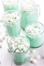 Hot white mint chocolate with marshmallows, white background. Holidey drink