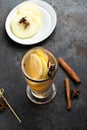 Hot winter Christmas drink in a glass mug: herbal tea with cinnamon Royalty Free Stock Photo