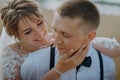 Hot woman showing tenderness man in garden. Portrait of sexy couple expressing feelings in park. Close up gorgeous bride Royalty Free Stock Photo