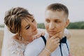 Hot woman showing tenderness man in garden. Portrait of sexy couple expressing feelings in park. Close up gorgeous bride Royalty Free Stock Photo