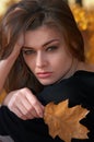 Hot young woman in autumn park