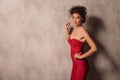 Hot young woman in a red short dress posing Royalty Free Stock Photo