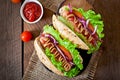 Hotdog with ketchup, mustard, lettuce and vegetables Royalty Free Stock Photo