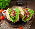 Hotdog with ketchup, mustard, lettuce and vegetables Royalty Free Stock Photo