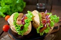 Hotdog with ketchup, mustard, lettuce and vegetables Royalty Free Stock Photo