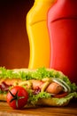 Hotdog with ketchup, mustard and vegetables Royalty Free Stock Photo