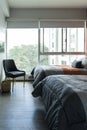 Hotel airbnb room with freshly made king sized bed with headboard, perfectly clean and ironed sheets Royalty Free Stock Photo