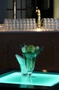 Hotel ballroom with luminous tables and a bar unit