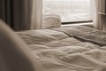 Hotel Bed Background With White Linen, Bathrobes and City View Royalty Free Stock Photo