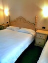 Hotel bedroom with bedside tables and telephone