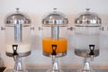 Hotel beverages dispensers. Drinking water, fresh milk and orange juice Royalty Free Stock Photo