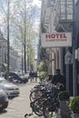 Hotel with bicycles parked in front of it in Amsterdam