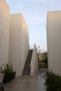 Hotel in Bodrum, Turkey, minimalistic white Mediterranean buildings with stairs and blue sky in the evening Royalty Free Stock Photo