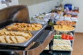 Hotel breakfast board in a family hotel. Buffet with different dishes.