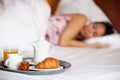 Hotel breakfast and a sleeping woman Royalty Free Stock Photo