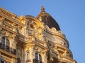 Hotel Carlton one of towers and fragment of exterior design, decorative stucco molding view from the boulevard Croisette