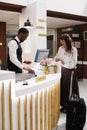 Hotel check-in with concierge assistance