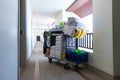 The hotel cleaning tool cart of housekeeper are on the walkway of resort area Royalty Free Stock Photo