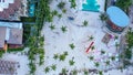Hotel complex from height of drone. Tractor on sandy beach cleaning, preparing for resort day Royalty Free Stock Photo