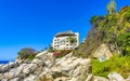 Hotel Condos Apartments on rocky cliff by sea and nature Royalty Free Stock Photo