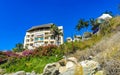 Hotel Condos Apartments on rocky cliff by sea and nature