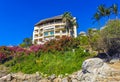 Hotel Condos Apartments on rocky cliff by sea and nature