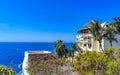 Hotel Condos Apartments on rocky cliff by sea and nature Royalty Free Stock Photo