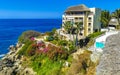 Hotel Condos Apartments on rocky cliff by sea and nature Royalty Free Stock Photo