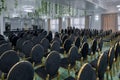 Hotel conference hall with empty chairs, green design with green plants and flowers Royalty Free Stock Photo