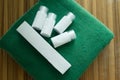 Hotel cosmetics kit on green towel