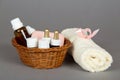 Hotel cosmetics kit and terry towel in basket